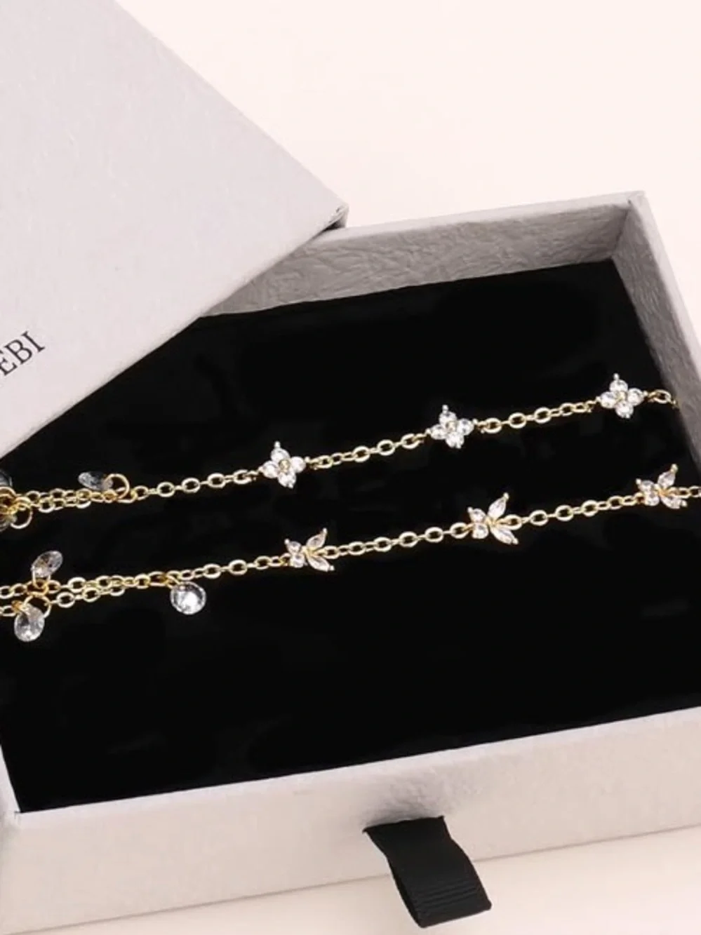 Anthropologie Gold Tone Floral Hand Chain with Clear Drops